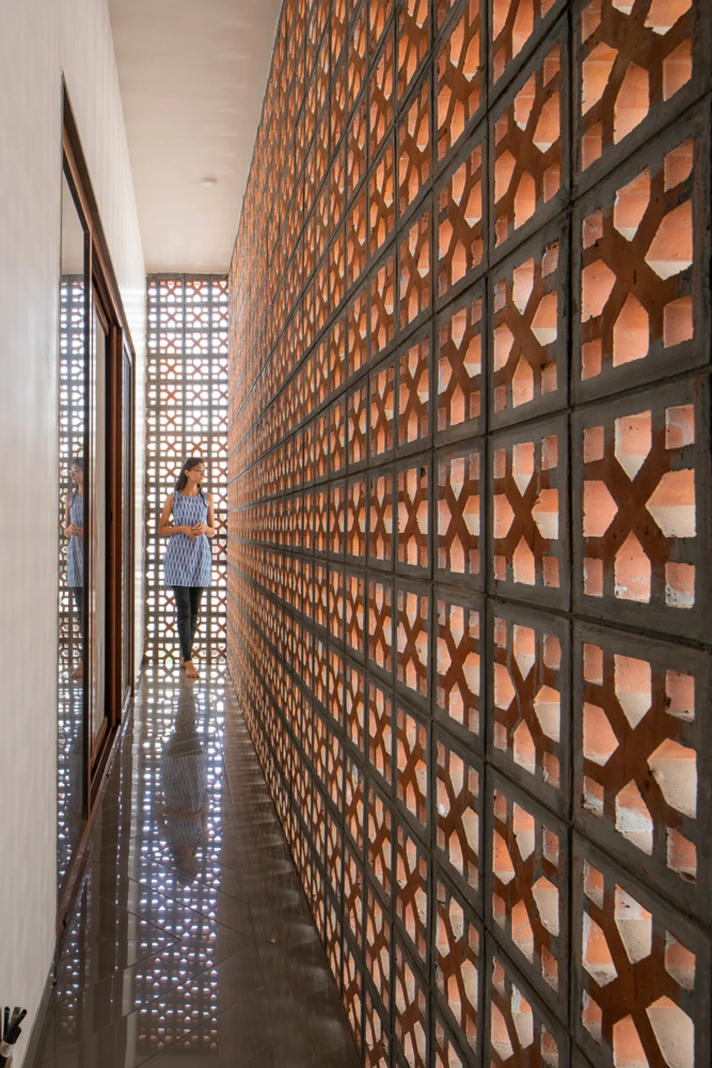 Terracotta jali design used as a stylish architectural screen in a modern Chennai home